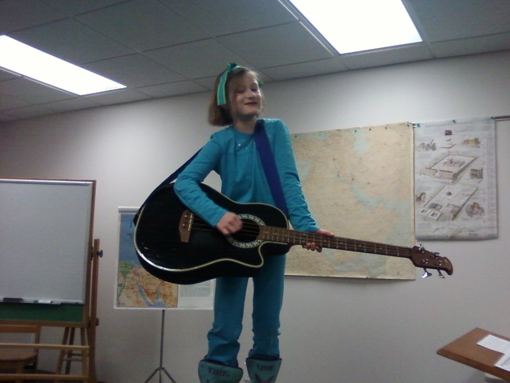 Teresa's friend, Joel Miller, who plays in our band, let Beki "play" his bass guitar and sing her song "Everything You Need in Mississippi" at band practice last night.